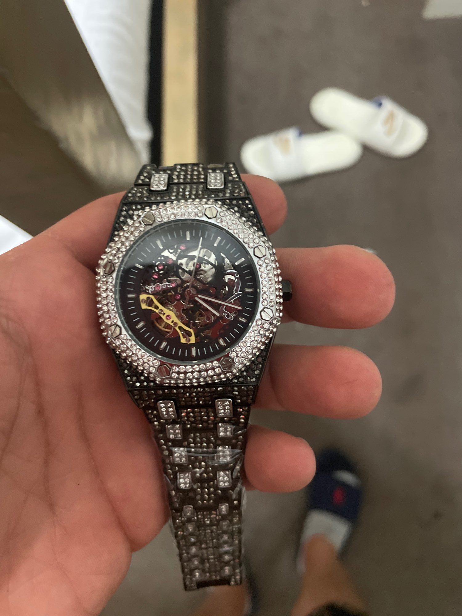 Iced out hot sale nixon watch